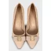 Patent leather shoes decorated with a bow