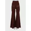 Flared trousers decorated with zippers