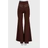 Flared trousers decorated with zippers