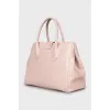 Pink leather bag with gold hardware