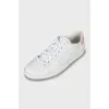 White leather sneakers with brand logo