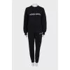 Black suit with embroidered logo