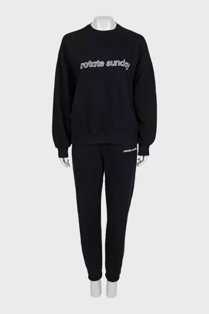 Black suit with embroidered logo