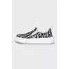 Textile slip-ons with signature print