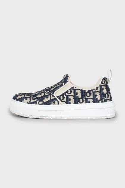 Textile slip-ons with signature print