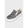 Textile slip-ons with signature print