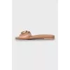 Brown leather flip flops with decor