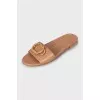 Brown leather flip flops with decor
