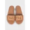 Brown leather flip flops with decor