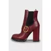 Red ankle boots with perforation