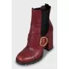 Red ankle boots with perforation