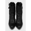 Leather ankle boots decorated with buckles
