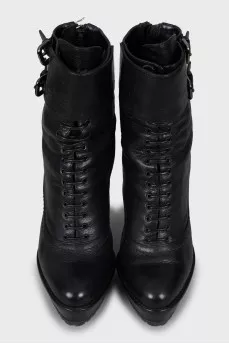 Leather ankle boots decorated with buckles