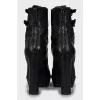 Leather ankle boots decorated with buckles