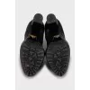Leather ankle boots decorated with buckles