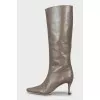 Brown boots with a figured heel