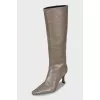 Brown boots with a figured heel