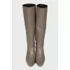 Brown boots with a figured heel