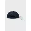 Denim cap with tag