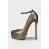 Golden high heels