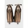 Golden high heels