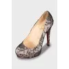 High heel shoes decorated with lace