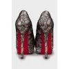 High heel shoes decorated with lace