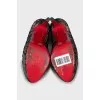 High heel shoes decorated with lace