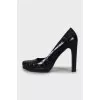 Black shoes with embossed leather