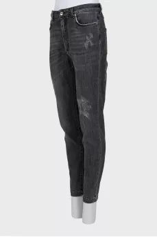 Grey jeans with a distressed effect