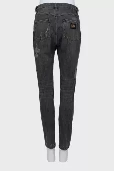 Grey jeans with a distressed effect