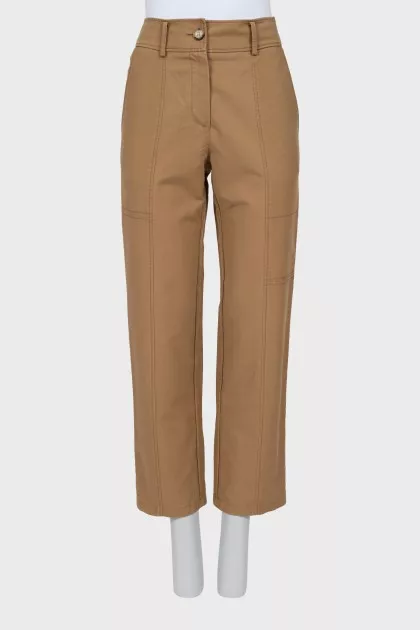 Beige trousers with raised seams