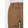 Beige trousers with raised seams
