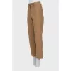 Beige trousers with raised seams