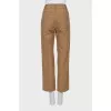 Beige trousers with raised seams