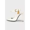 Patent leather shoes with a golden lock