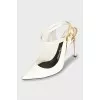 Patent leather shoes with a golden lock