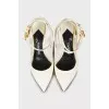 Patent leather shoes with a golden lock