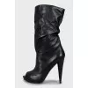 Wedge heel boots with tag