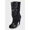 Wedge heel boots with tag