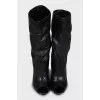 Wedge heel boots with tag