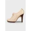 Ankle boots with perforated leather