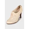 Ankle boots with perforated leather
