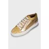 Gold leather sneakers