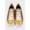 Gold leather sneakers