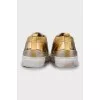 Gold leather sneakers