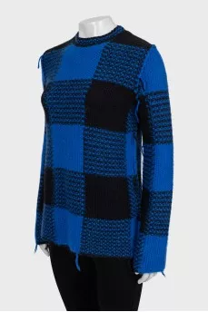 Checkered sweater with seams on the outside
