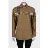 Khaki jacket decorated with beads