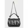Quilted bag decorated with spikes