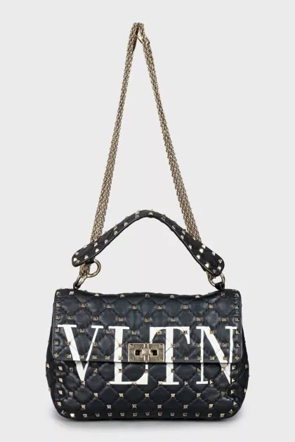 Quilted bag decorated with spikes